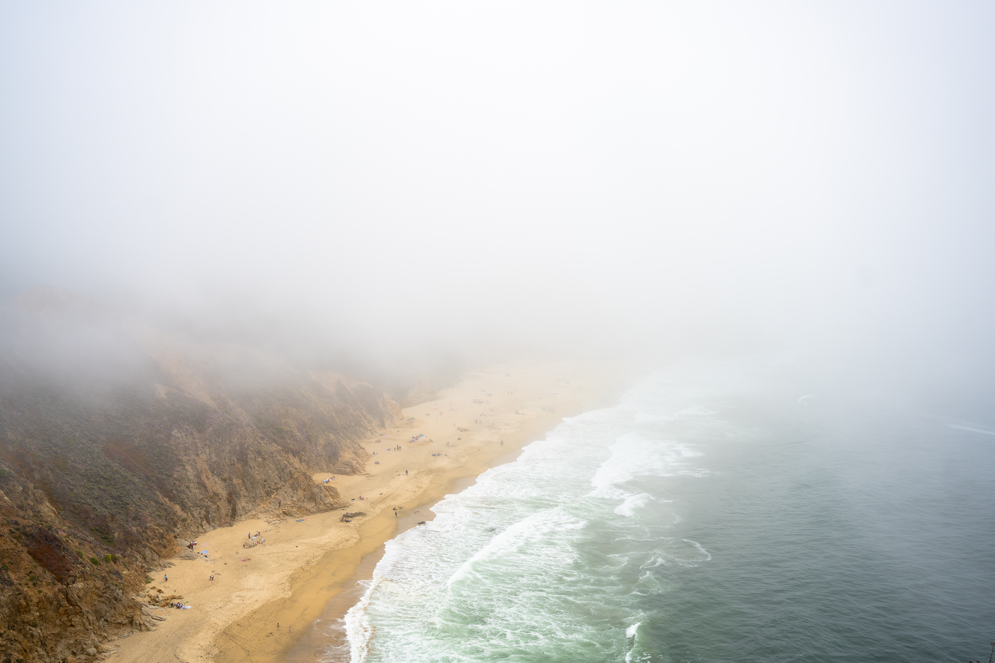 a beach along Route 1 covered by the fog (photo credit spencerchang.photography)